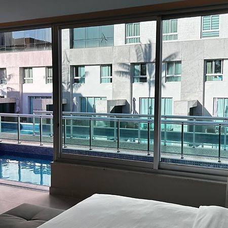 Jade Hotel Brasilia Candangolandia Екстер'єр фото A view of the pool from a guest room